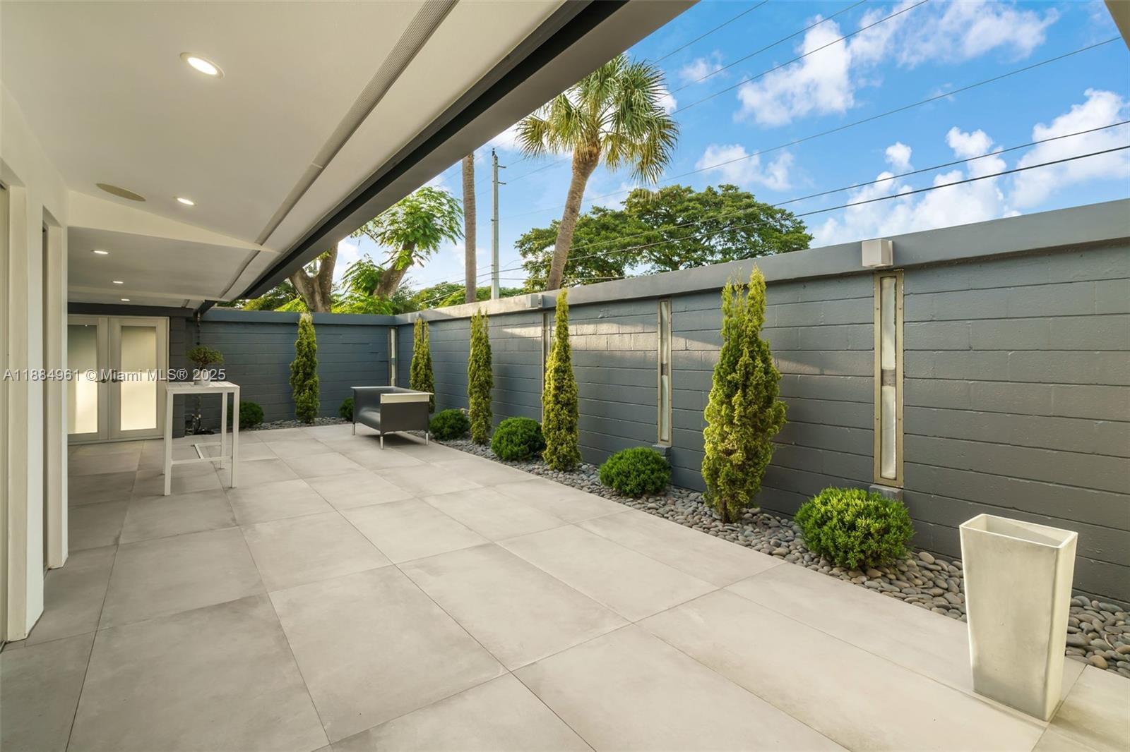 7550 Southwest 60th Street Miami, FL 33143 - Photo 16 of 64 Front Courtyard space for seamless indoor-outdoor entertainment