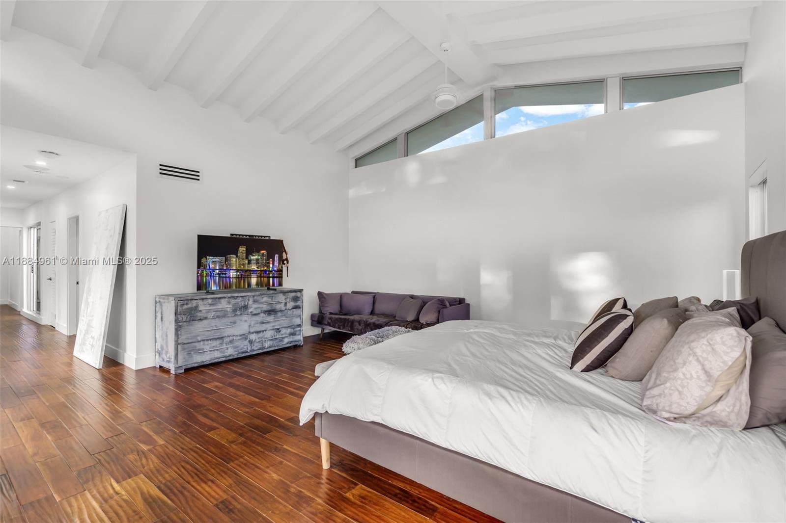 7550 Southwest 60th Street Miami, FL 33143 - Photo 22 of 64 a bedroom with furniture and a wooden floor