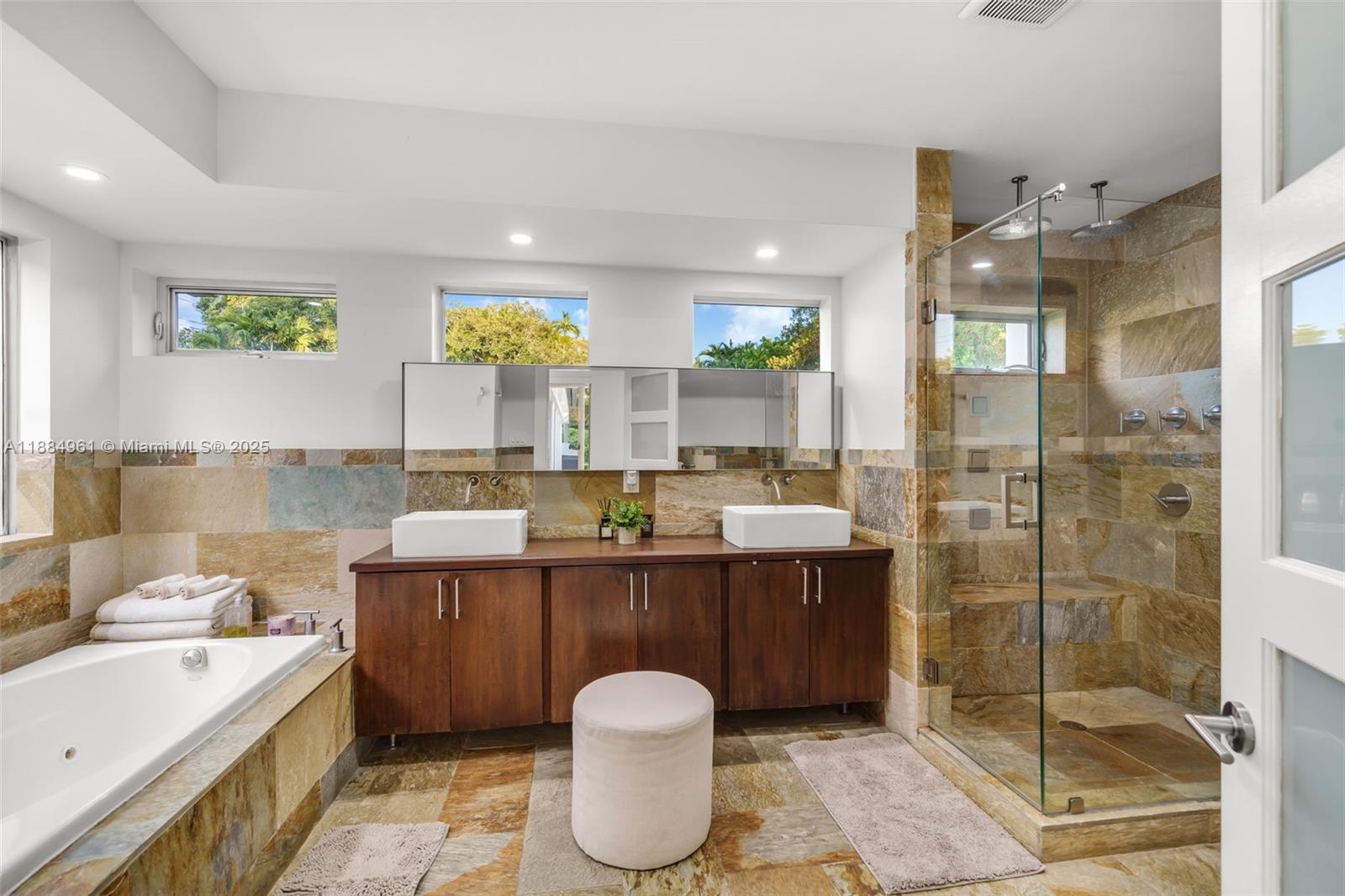 7550 Southwest 60th Street Miami, FL 33143 - Photo 23 of 64 a bathroom with a tub sink and mirror