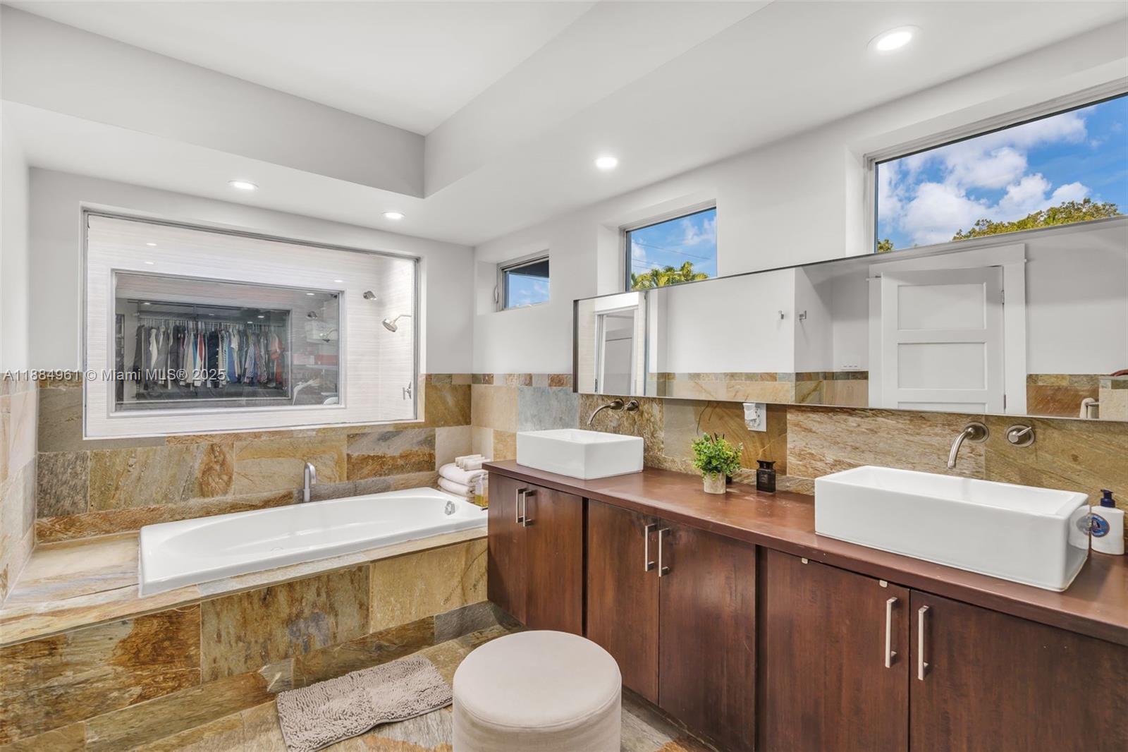 7550 Southwest 60th Street Miami, FL 33143 - Photo 25 of 64 a bathroom with a sink a toilet and mirror