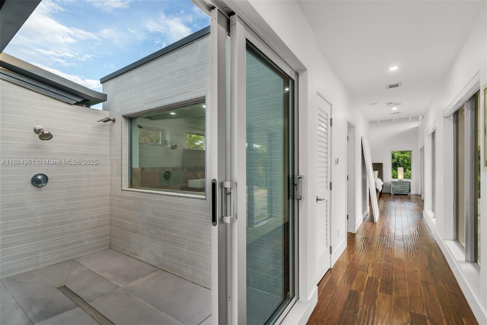 7550 Southwest 60th Street Miami, FL 33143 - Photo 28 of 64 a view of a hallway with wooden floor and staircase