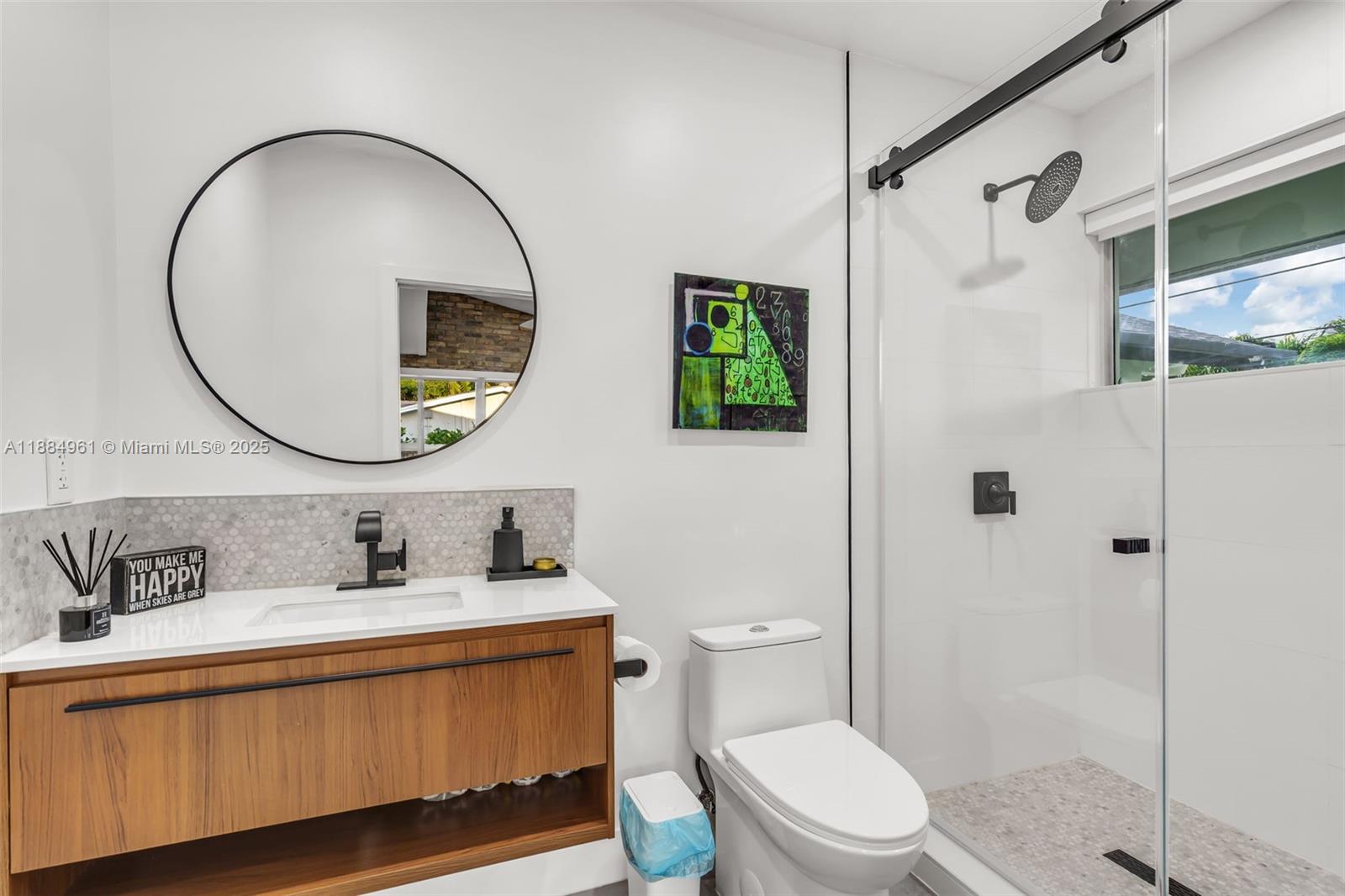 7550 Southwest 60th Street Miami, FL 33143 - Photo 34 of 64 a bathroom with a sink a toilet and shower