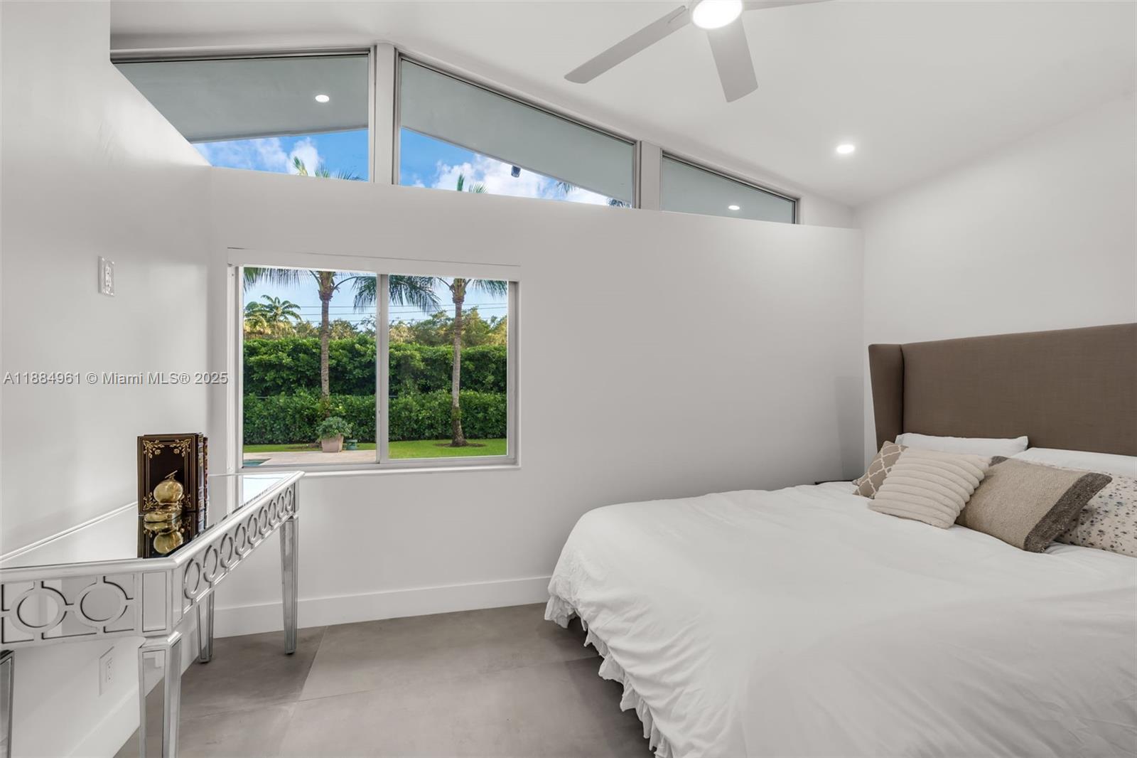 7550 Southwest 60th Street Miami, FL 33143 - Photo 36 of 64 a bedroom with a bed and a window