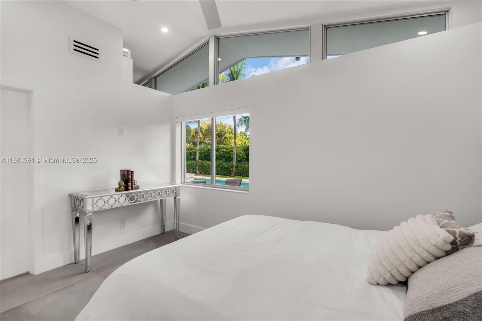 7550 Southwest 60th Street Miami, FL 33143 - Photo 37 of 64 a bedroom with a bed and a desk