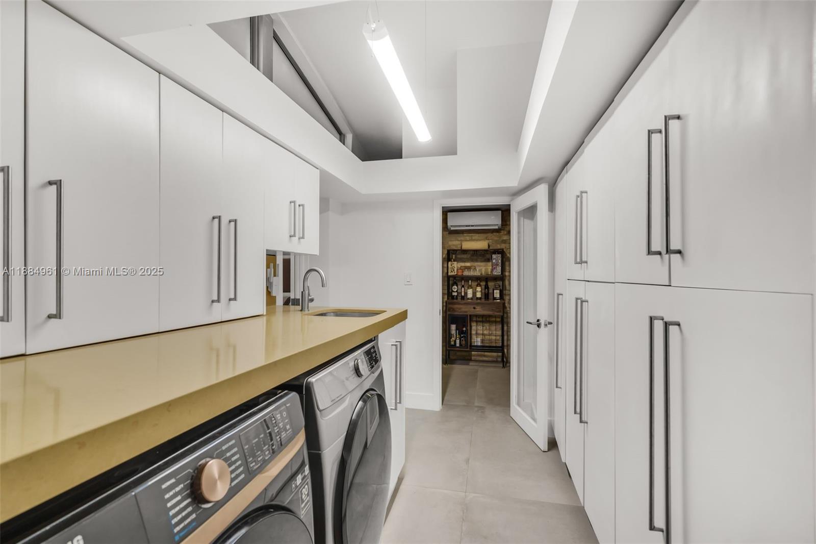 7550 Southwest 60th Street Miami, FL 33143 - Photo 41 of 64 a view of a kitchen with furniture and an empty room