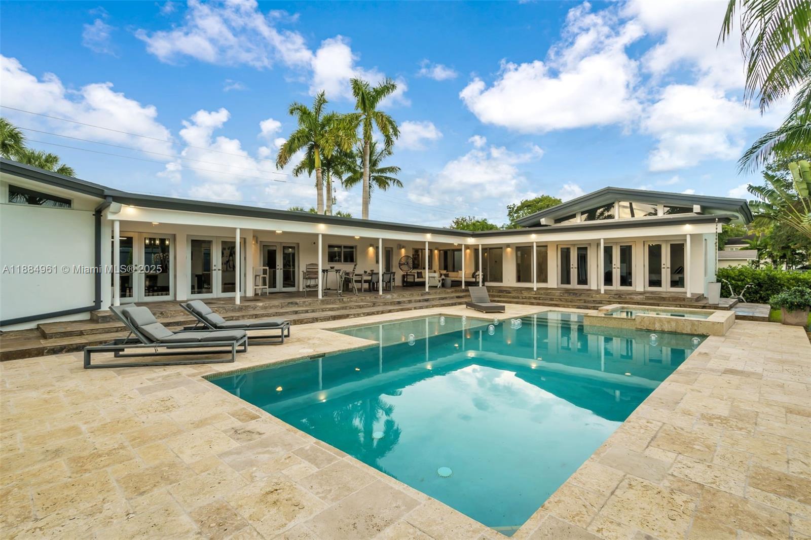 7550 Southwest 60th Street Miami, FL 33143 - Photo 43 of 64 a view of a house with a swimming pool