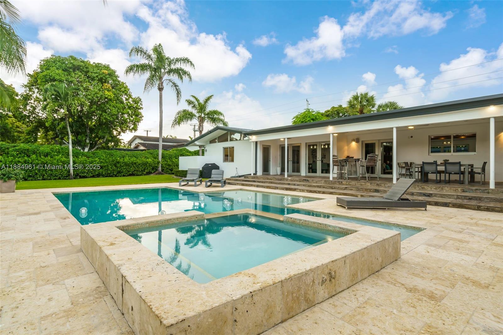 7550 Southwest 60th Street Miami, FL 33143 - Photo 45 of 64 a view of a house with swimming pool and a yard