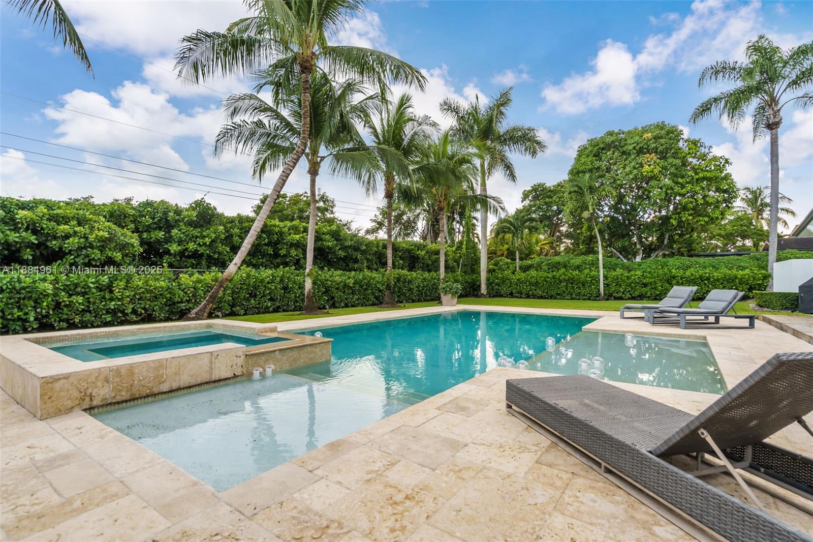 7550 Southwest 60th Street Miami, FL 33143 - Photo 46 of 64 a view of a swimming pool with a table and chairs