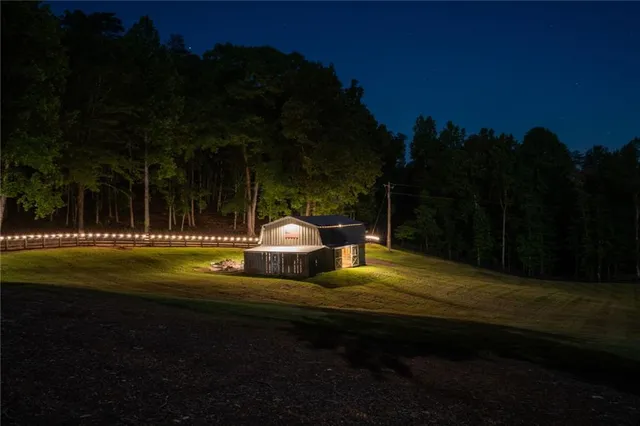 a view of an empty room with a glass door and chair