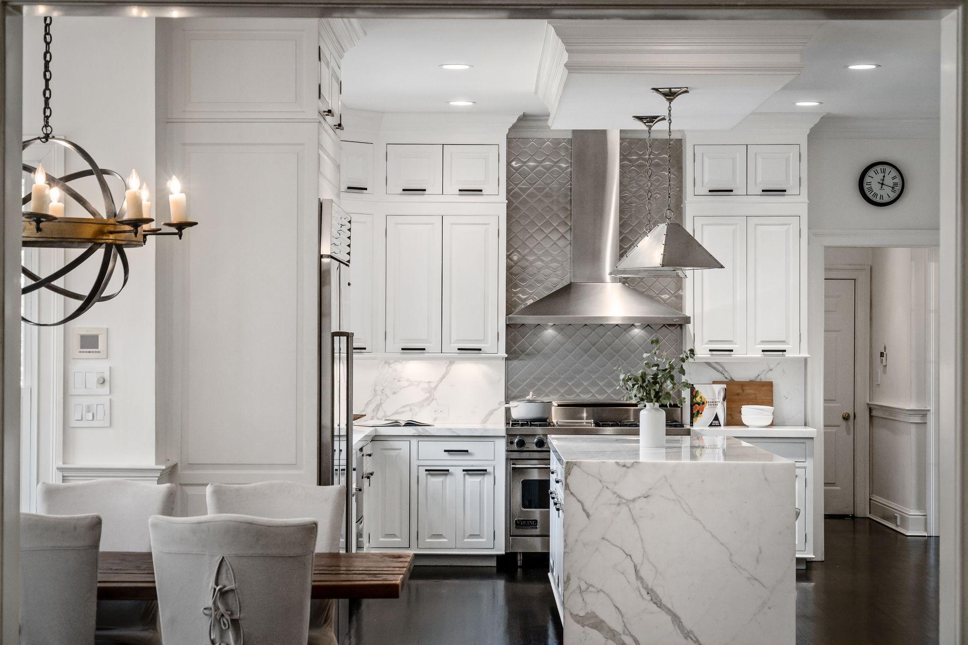 494 Ponus Ridge Road New Canaan, CT 06840 - Photo 12 of 30 a kitchen with stainless steel appliances kitchen island a refrigerator sink and cabinets