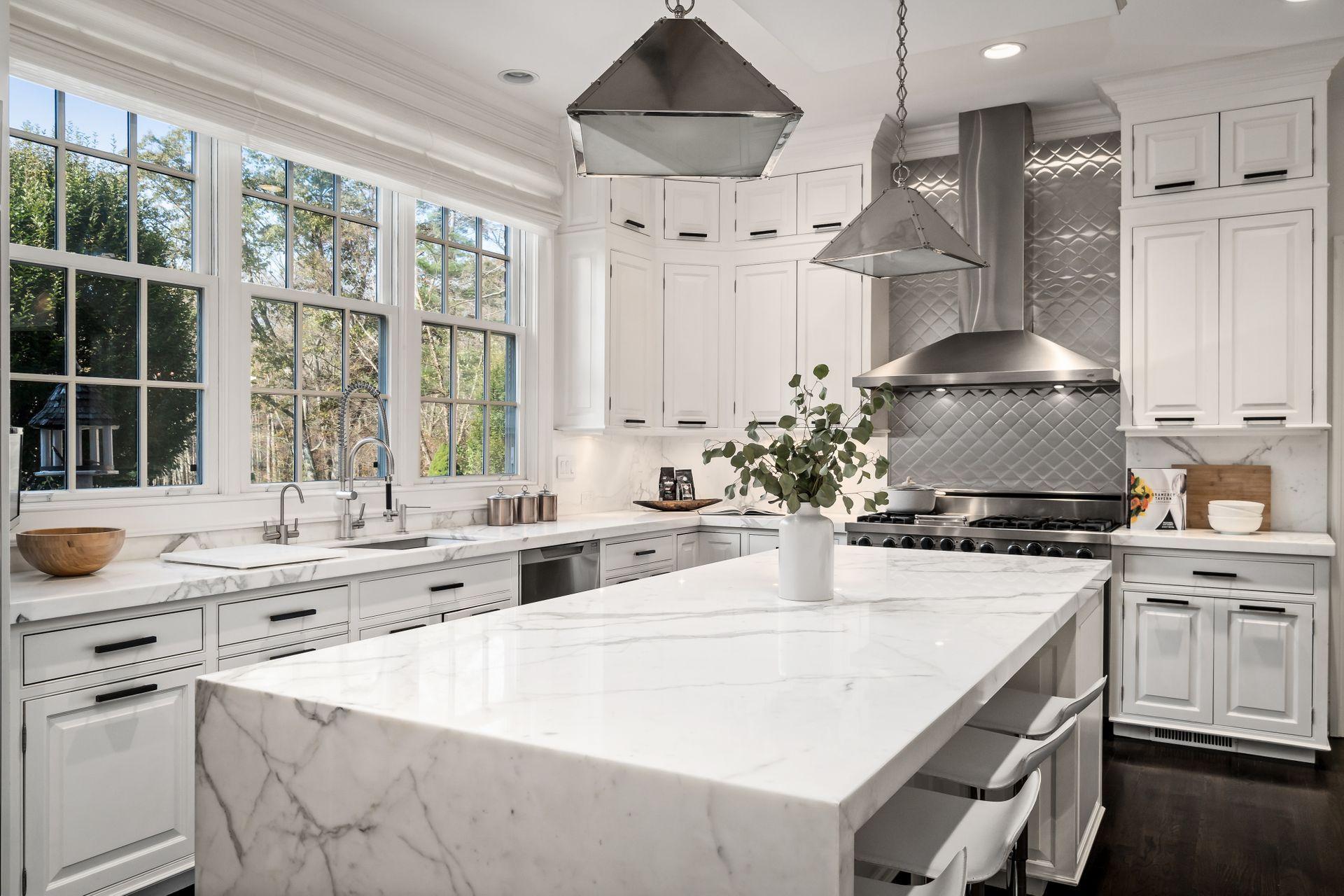 494 Ponus Ridge Road New Canaan, CT 06840 - Photo 13 of 30 a kitchen with stainless steel appliances a sink stove and cabinets