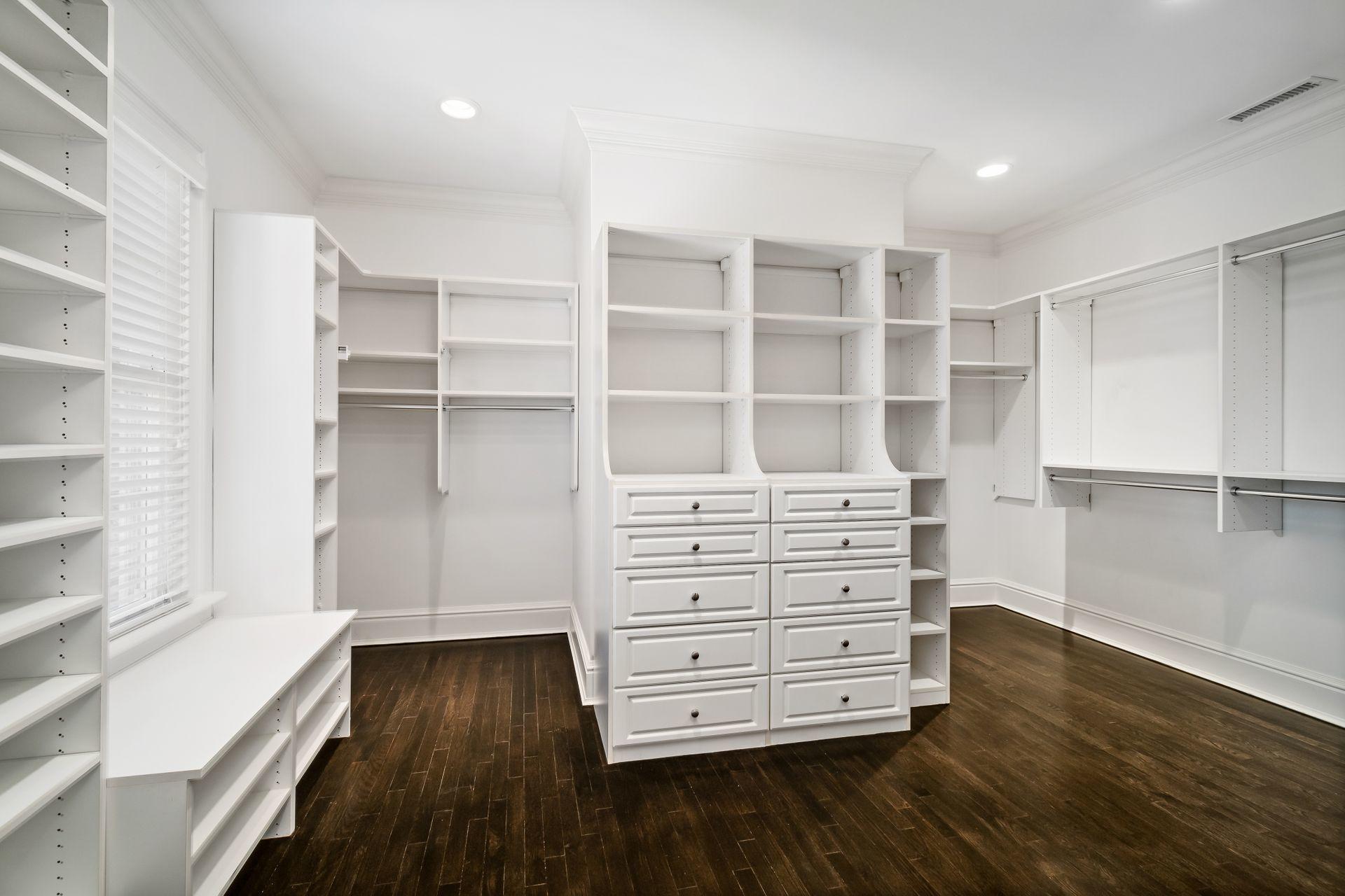 494 Ponus Ridge Road New Canaan, CT 06840 - Photo 17 of 30 a view of walk in closet with empty racks