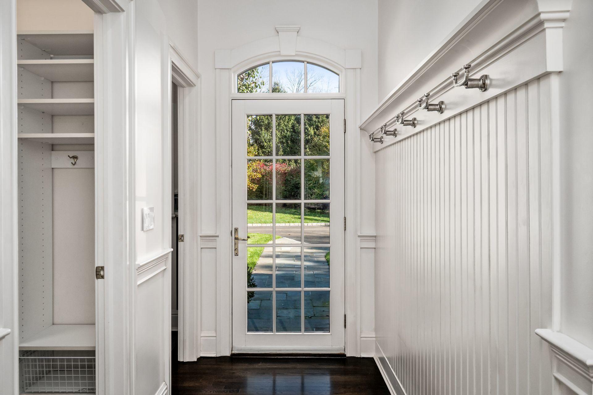 494 Ponus Ridge Road New Canaan, CT 06840 - Photo 24 of 30 a view of front door with wooden floor