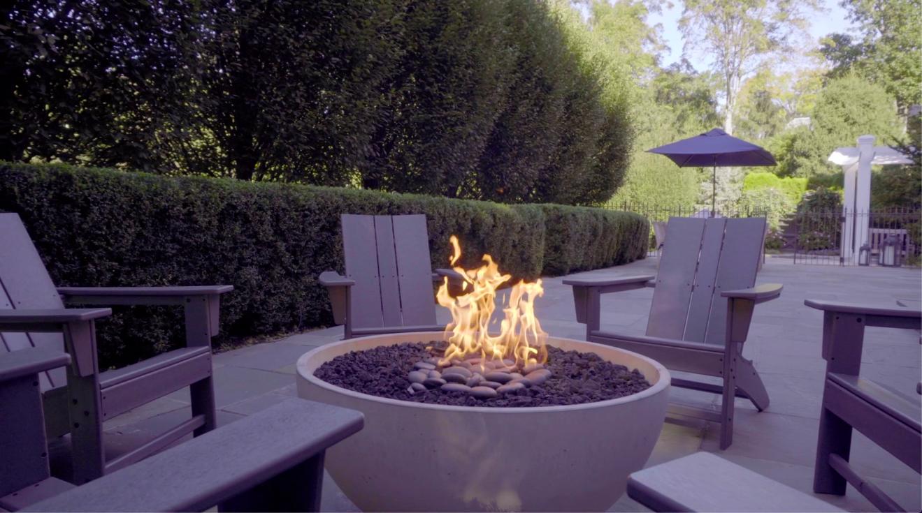 494 Ponus Ridge Road New Canaan, CT 06840 - Photo 25 of 30 a view of a table and chairs in the patio
