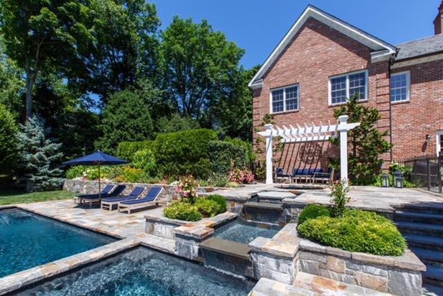 494 Ponus Ridge Road New Canaan, CT 06840 - Photo 27 of 30 a view of a chairs and table in backyard