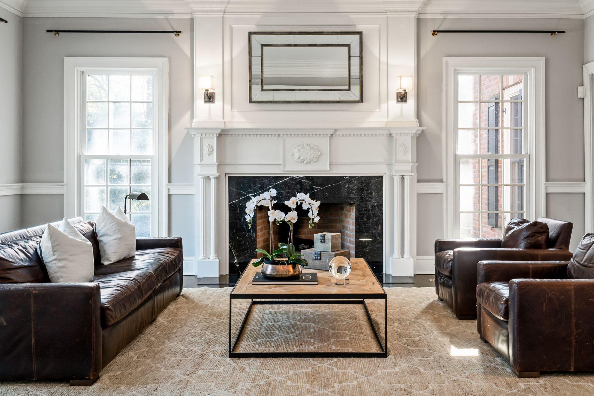 494 Ponus Ridge Road New Canaan, CT 06840 - Photo 4 of 30 a living room with furniture and a fireplace