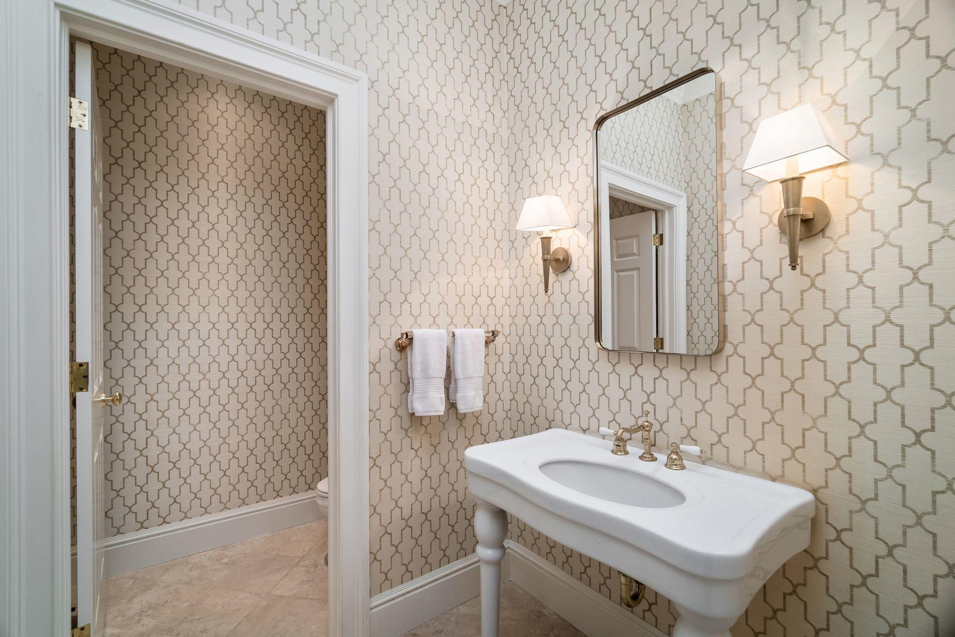 494 Ponus Ridge Road New Canaan, CT 06840 - Photo 5 of 30 a bathroom with a sink and a mirror