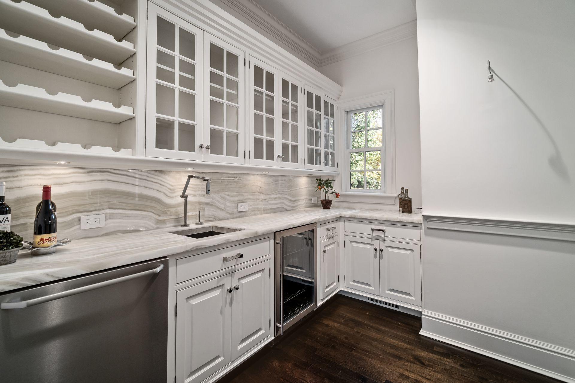 494 Ponus Ridge Road New Canaan, CT 06840 - Photo 7 of 30 a kitchen with a sink and a window