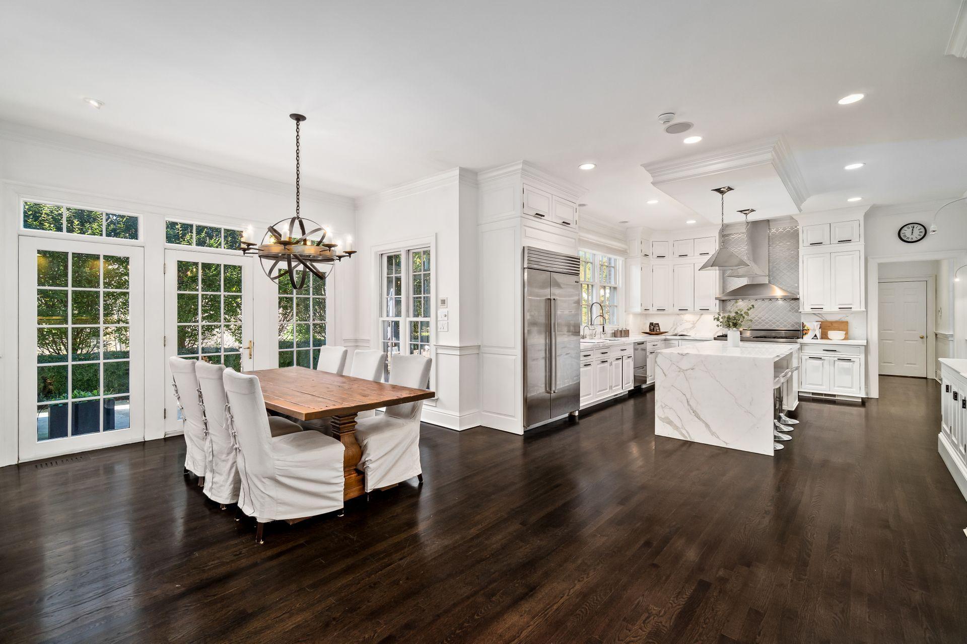 494 Ponus Ridge Road New Canaan, CT 06840 - Photo 10 of 30 a living room with furniture and kitchen view