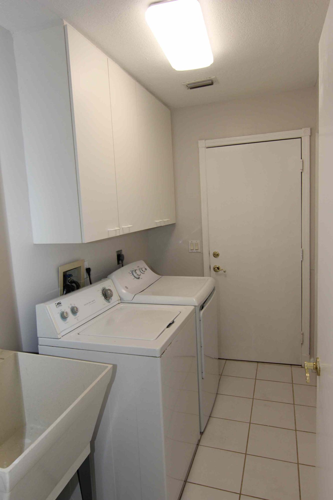 18540 Ocean Mist Drive Boca Raton, FL 33498 - Photo 13 of 37 a utility room with dryer and washer