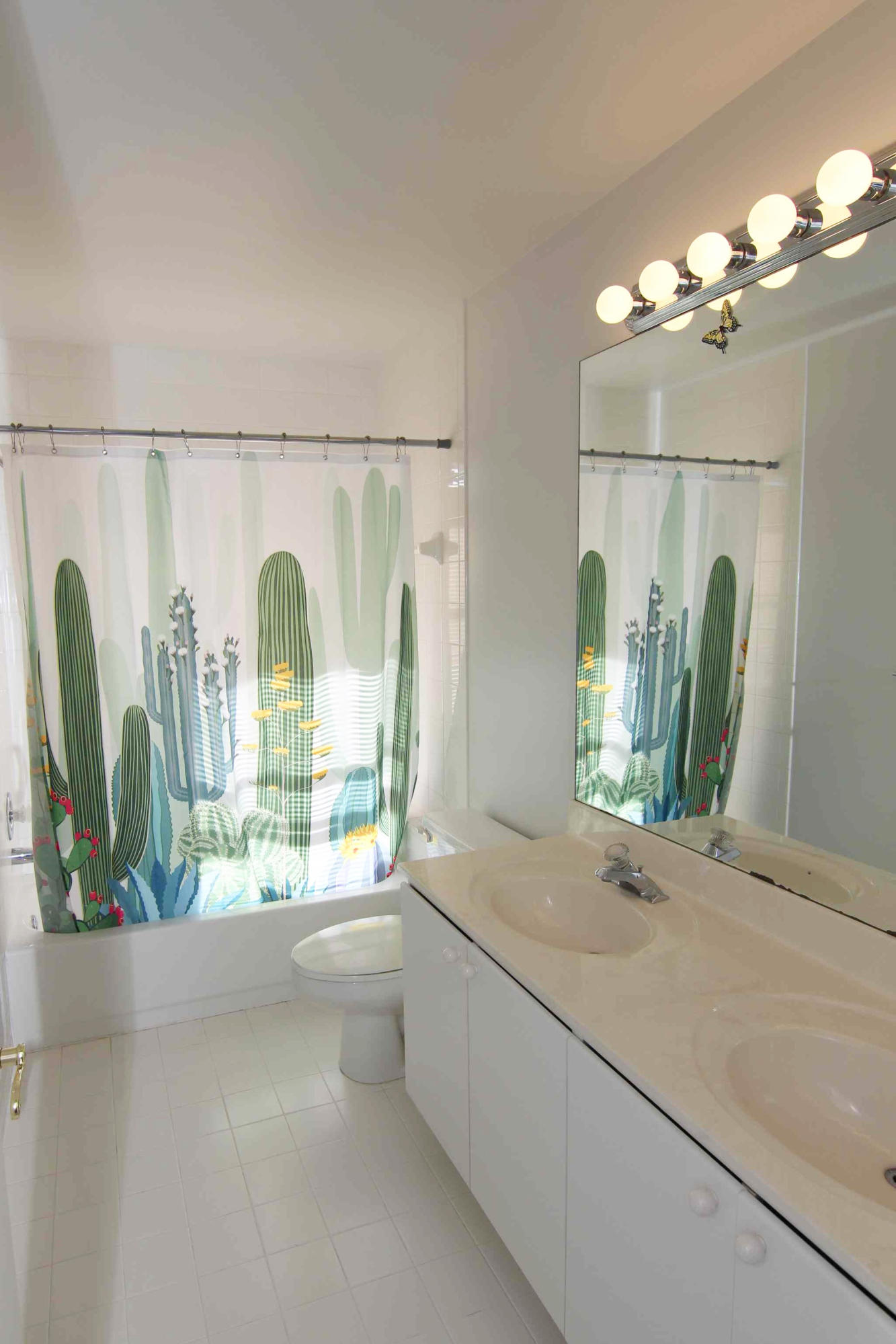 18540 Ocean Mist Drive Boca Raton, FL 33498 - Photo 23 of 37 a bathroom with a double vanity sink and a large mirror