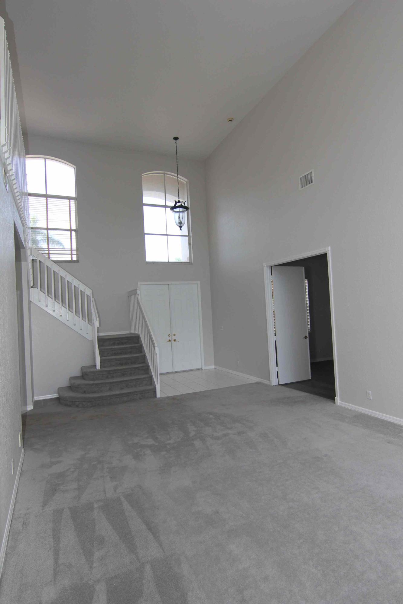 18540 Ocean Mist Drive Boca Raton, FL 33498 - Photo 3 of 37 an empty room with windows