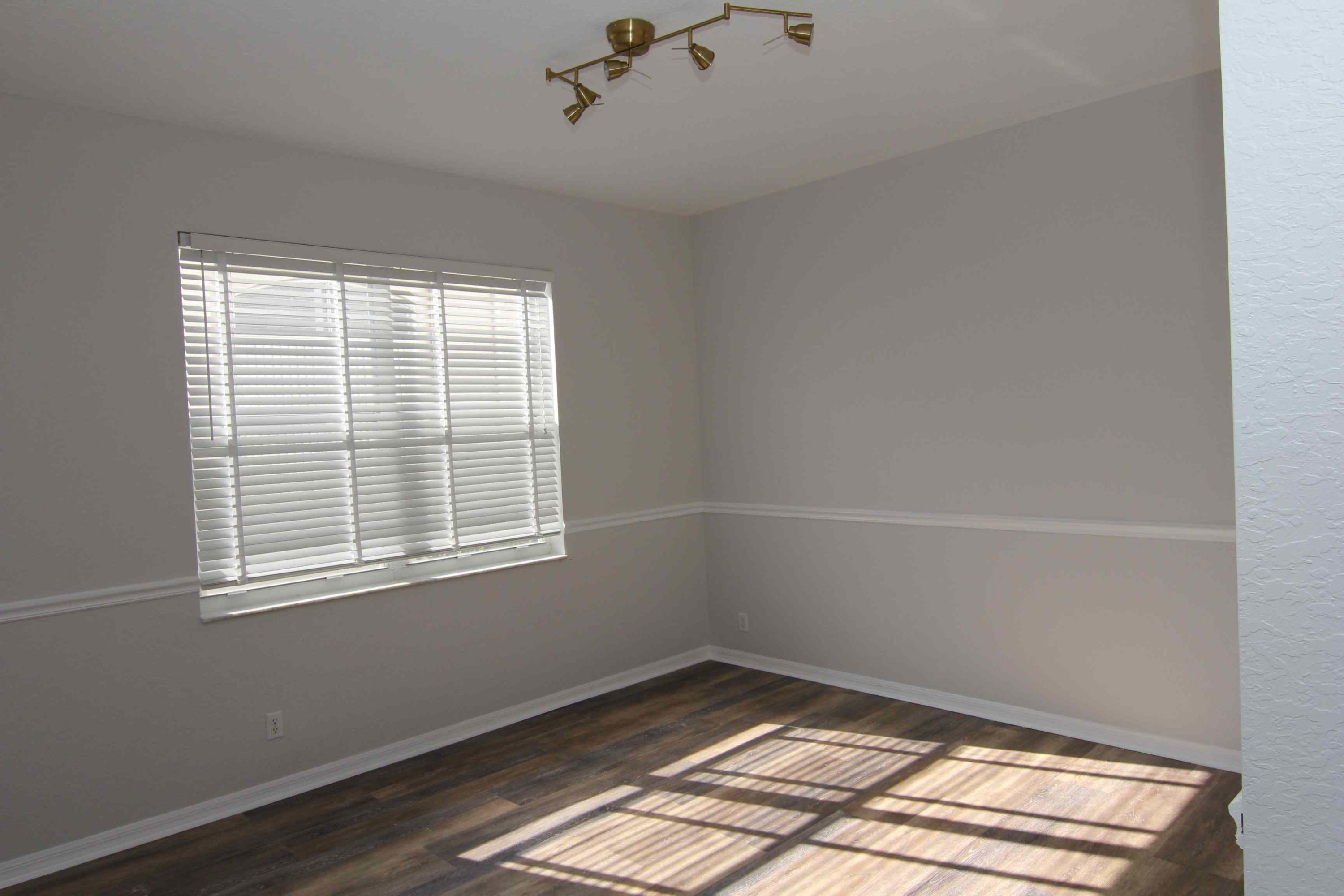 18540 Ocean Mist Drive Boca Raton, FL 33498 - Photo 8 of 37 a view of a room with wooden floor and windows