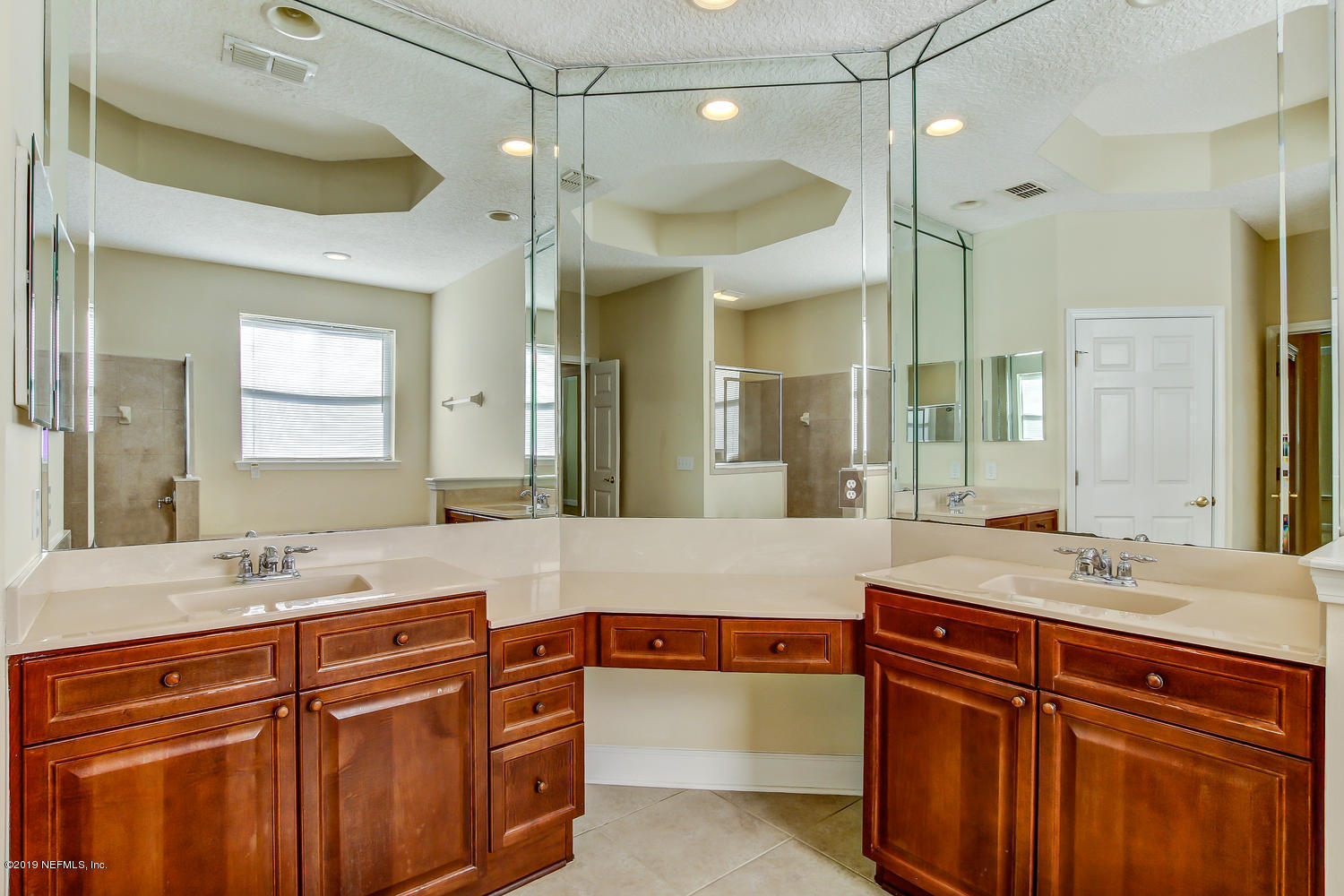 3993 Reds Gait Lane Jacksonville, FL 32223 - Photo 37 of 72 a bathroom with a sink double vanity and a shower