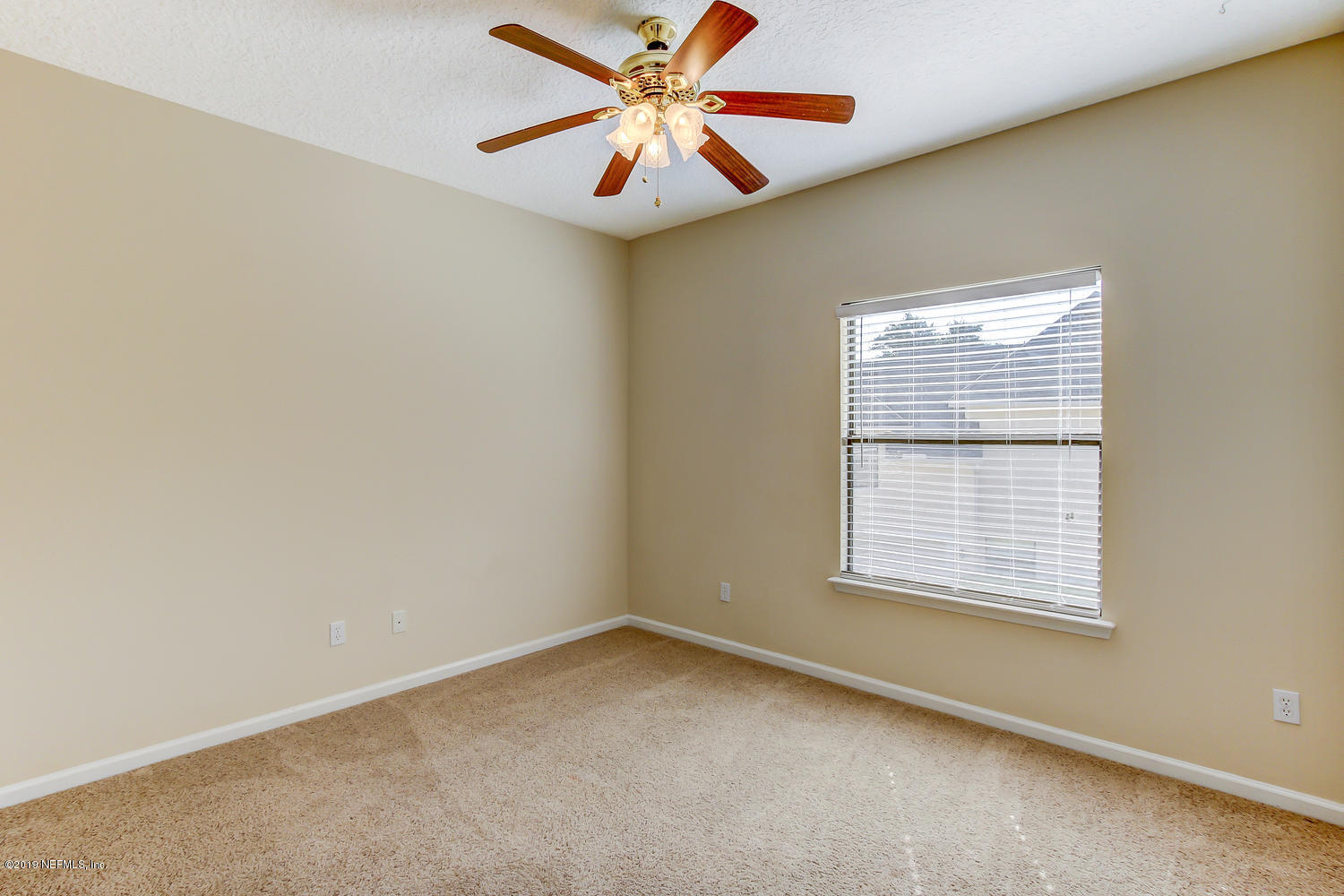 3993 Reds Gait Lane Jacksonville, FL 32223 - Photo 45 of 72 an empty room with a window and a fan