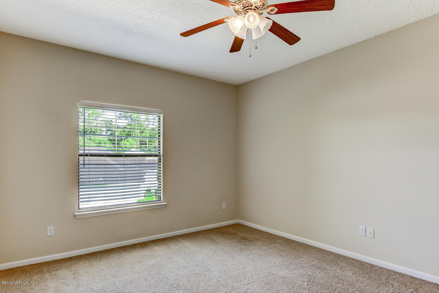 3993 Reds Gait Lane Jacksonville, FL 32223 - Photo 50 of 72 an empty room with windows and fan