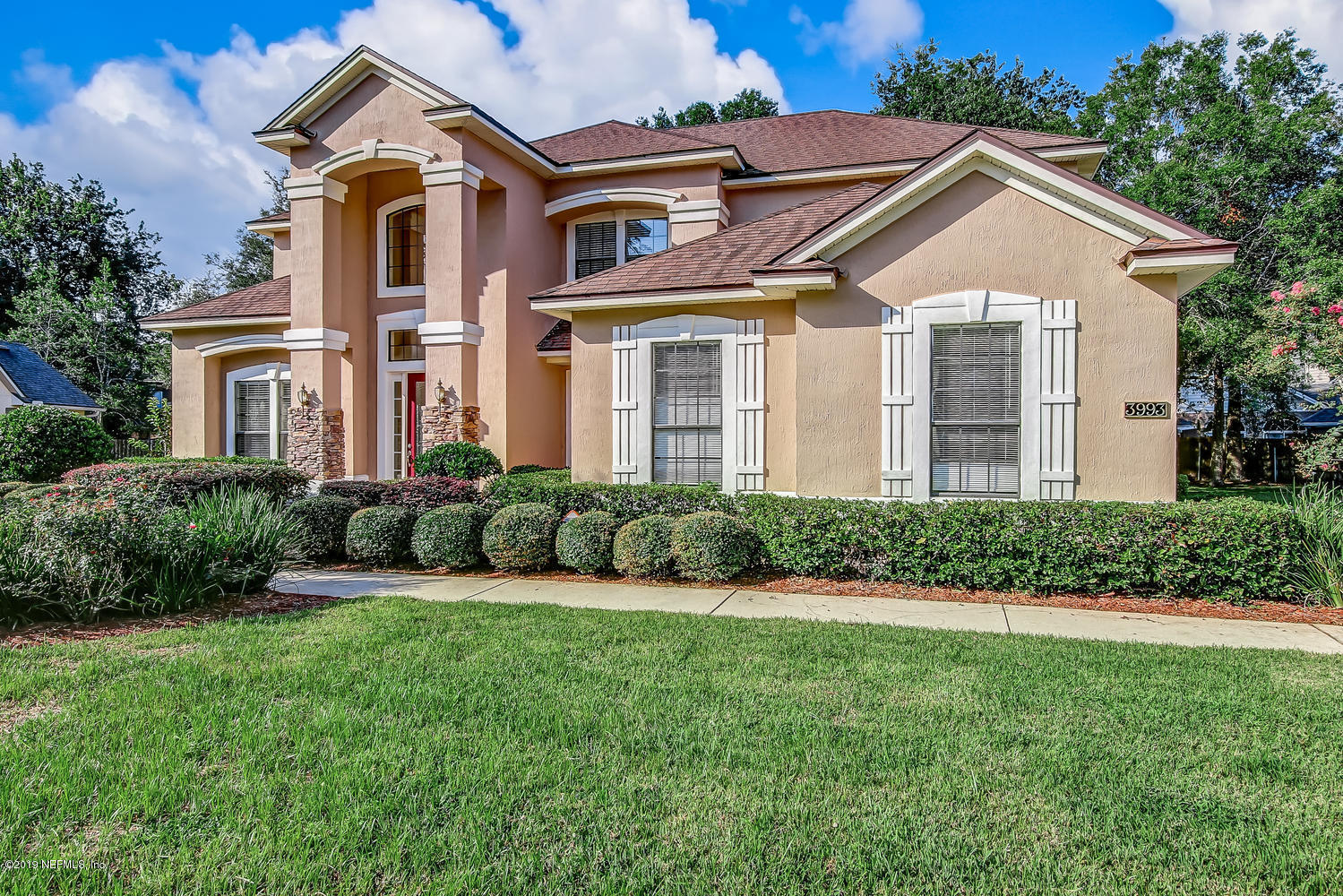 3993 Reds Gait Lane Jacksonville, FL 32223 - Photo 5 of 72 a front view of a house with a yard