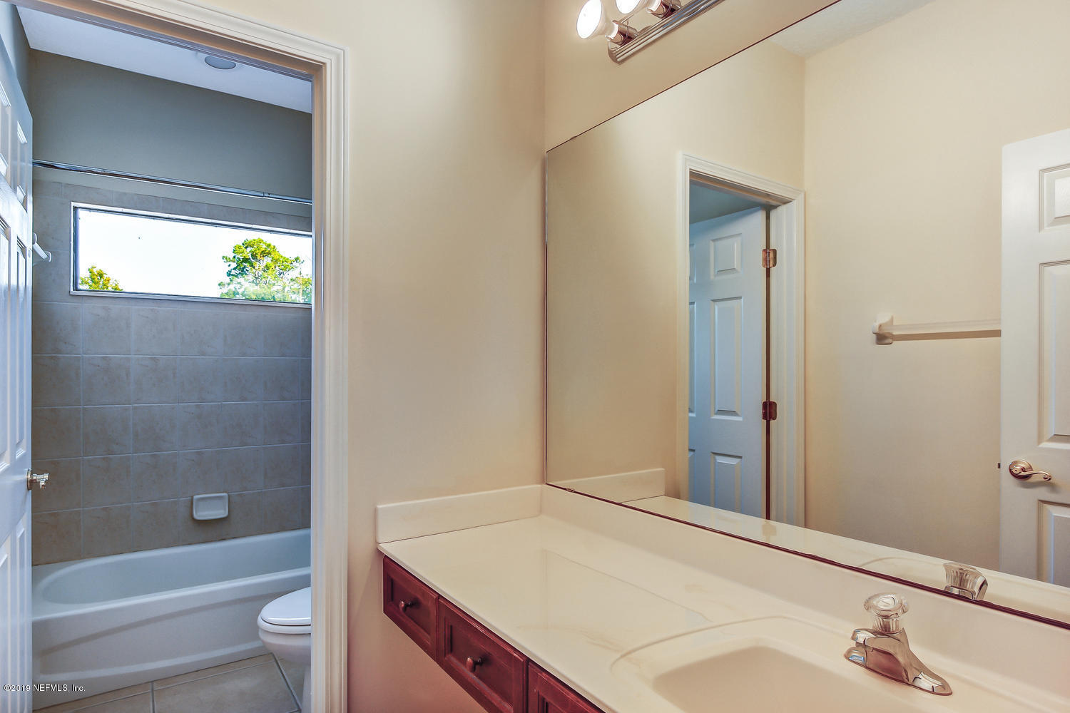 3993 Reds Gait Lane Jacksonville, FL 32223 - Photo 52 of 72 a bathroom with a sink and a tub