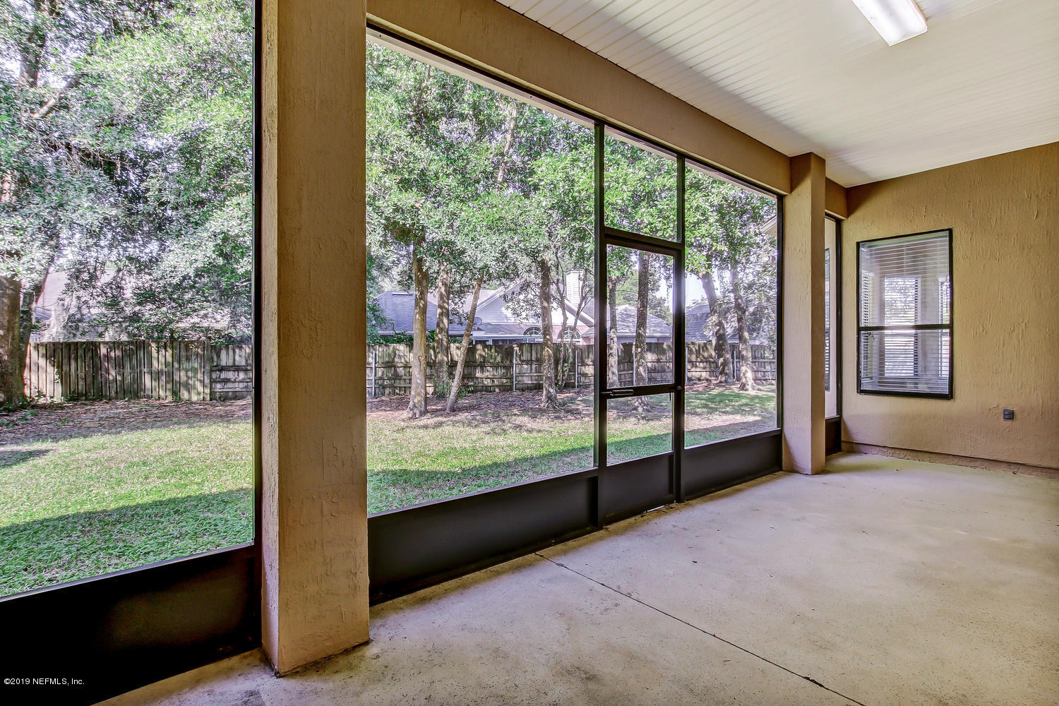 3993 Reds Gait Lane Jacksonville, FL 32223 - Photo 57 of 72 a view of a room with porch and wooden floor