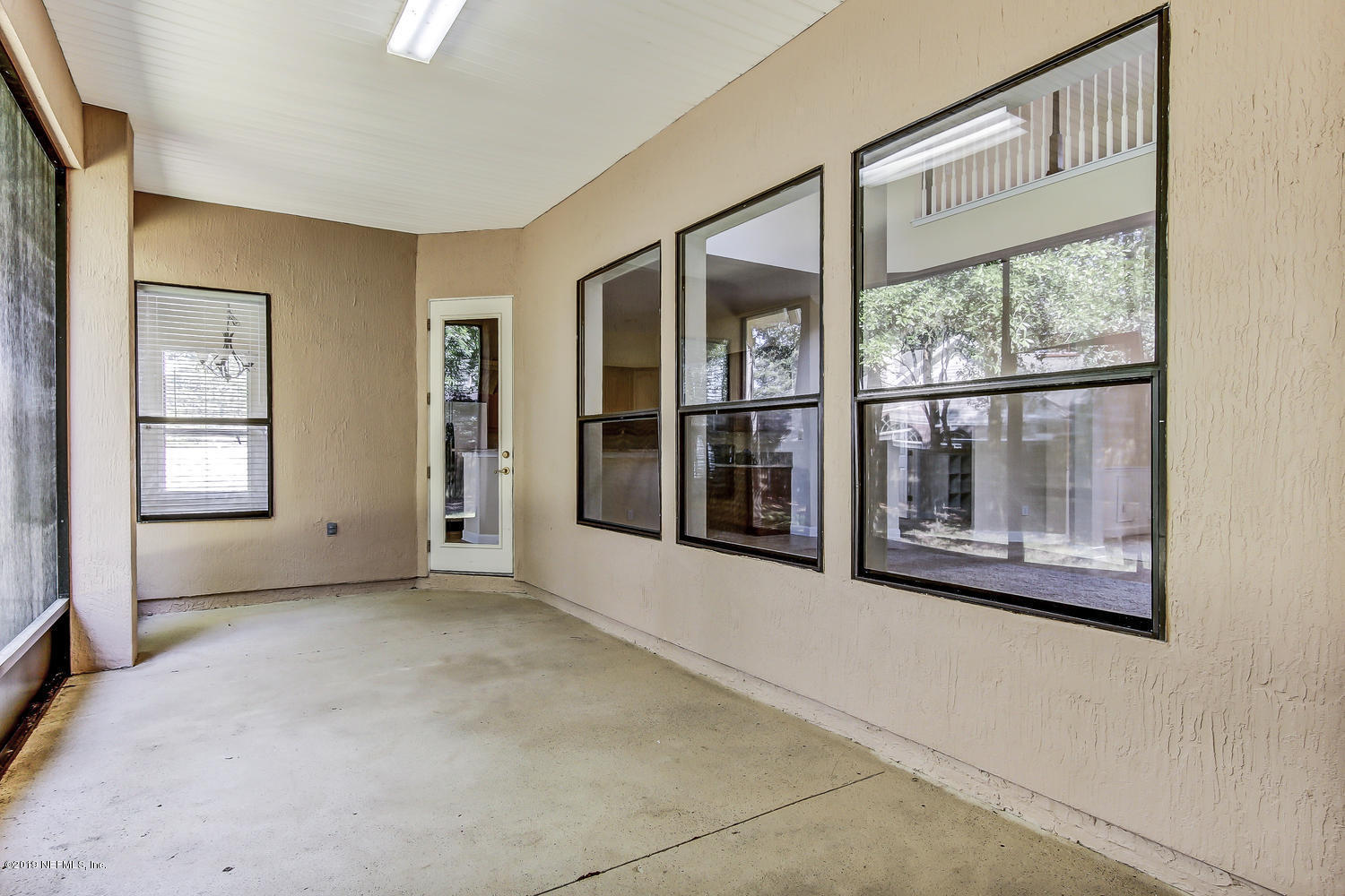 3993 Reds Gait Lane Jacksonville, FL 32223 - Photo 58 of 72 an empty room with windows and entrance