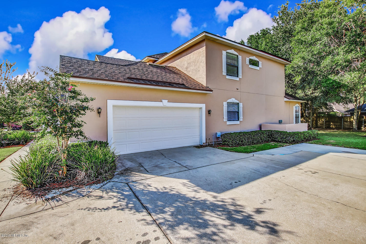 3993 Reds Gait Lane Jacksonville, FL 32223 - Photo 67 of 72 a front view of a house with a yard and garage