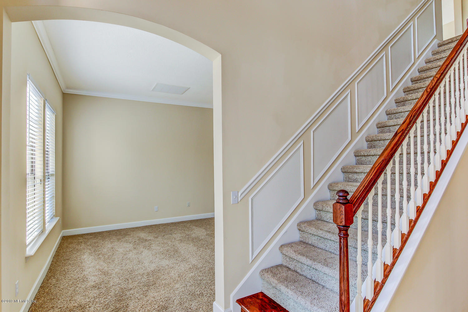 3993 Reds Gait Lane Jacksonville, FL 32223 - Photo 10 of 72 a view of staircase with wooden floor and stairs