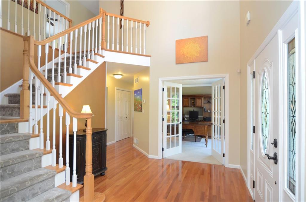 5007 Oak Point Drive McKees Rocks, PA 15136 - Photo 2 of 24 Open and Welcoming Foyer with Hardwood and Beveled-Glass Doors