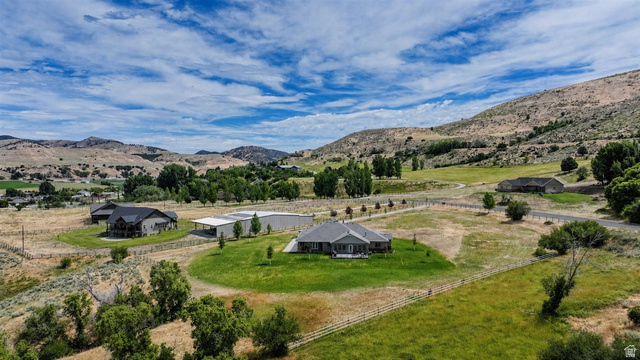 3123 East Riverdale Road Preston, ID 83263 - Photo 38 of 52 Expansive rural property featuring a main residence, multiple auxiliary buildings, and surrounding mountainous terrain