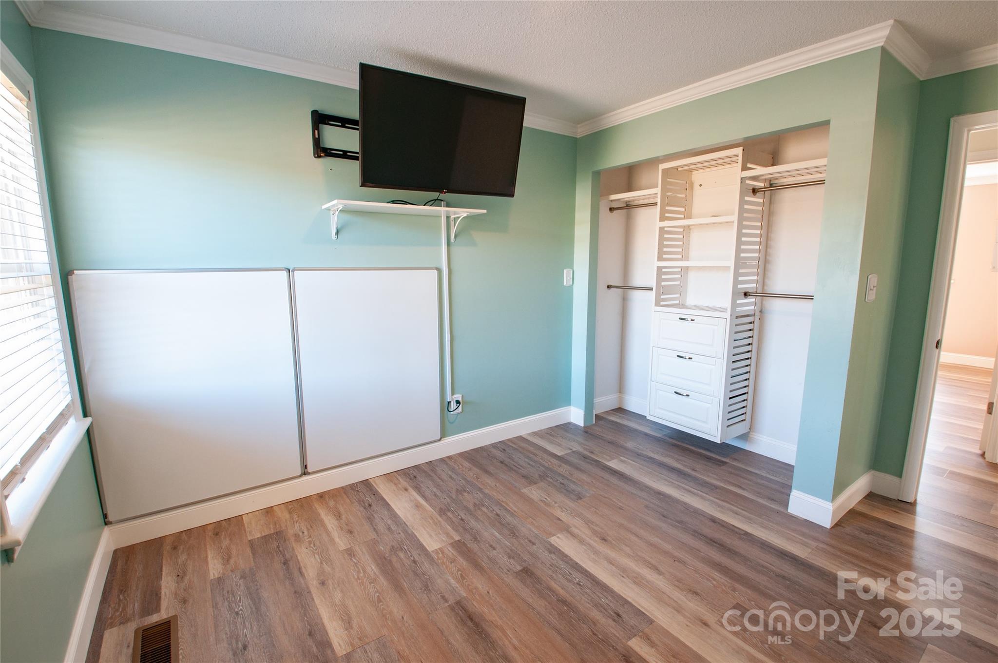182 Red Hawk Lane Olin, NC 28660 - Photo 11 of 14 a view of a livingroom with wooden floor