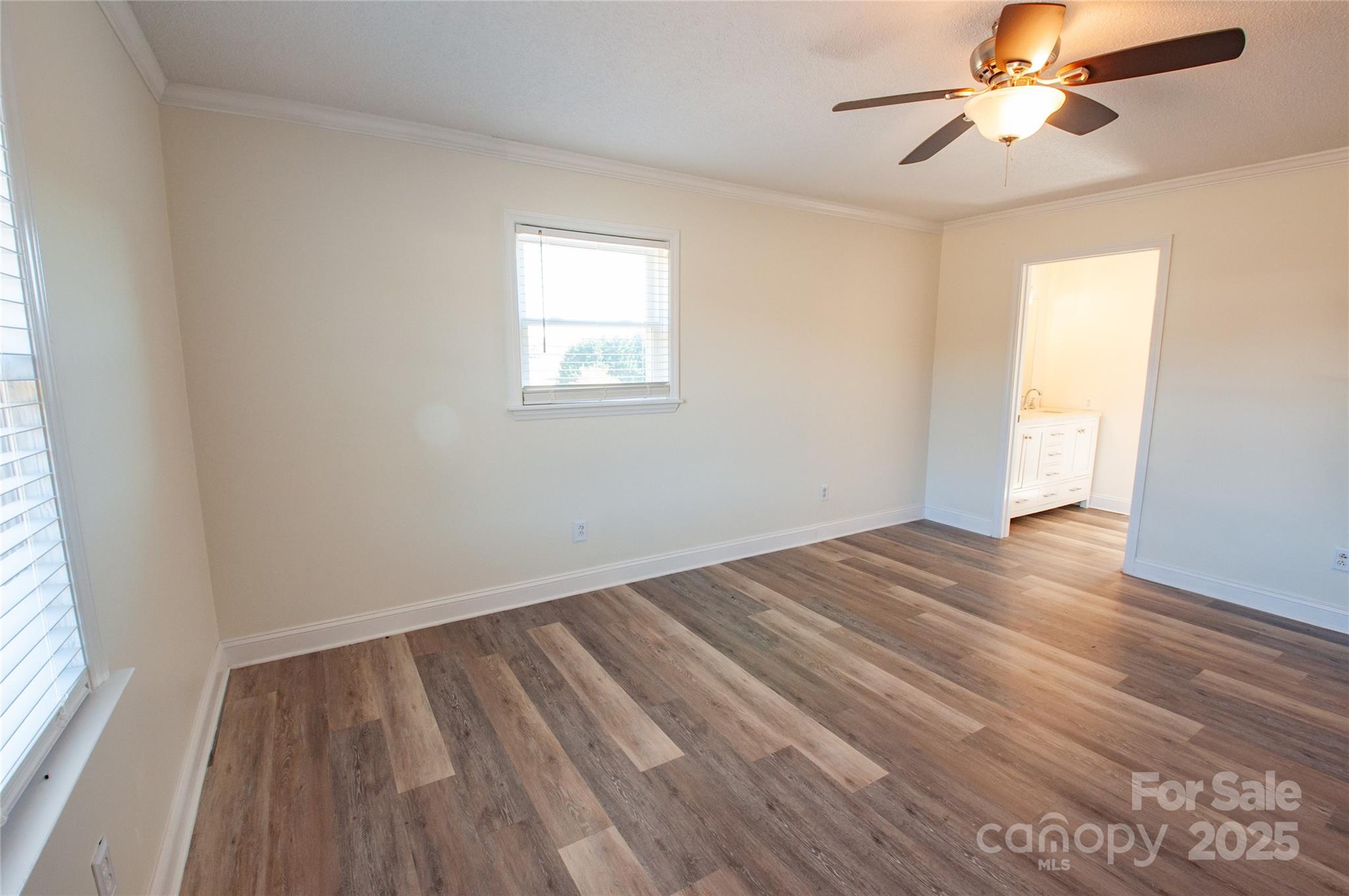 182 Red Hawk Lane Olin, NC 28660 - Photo 9 of 14 wooden floor in an empty room with a window