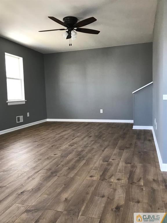902 Salem Road Burlington, NJ 08016 - Photo 13 of 17 an empty room with wooden floor and windows