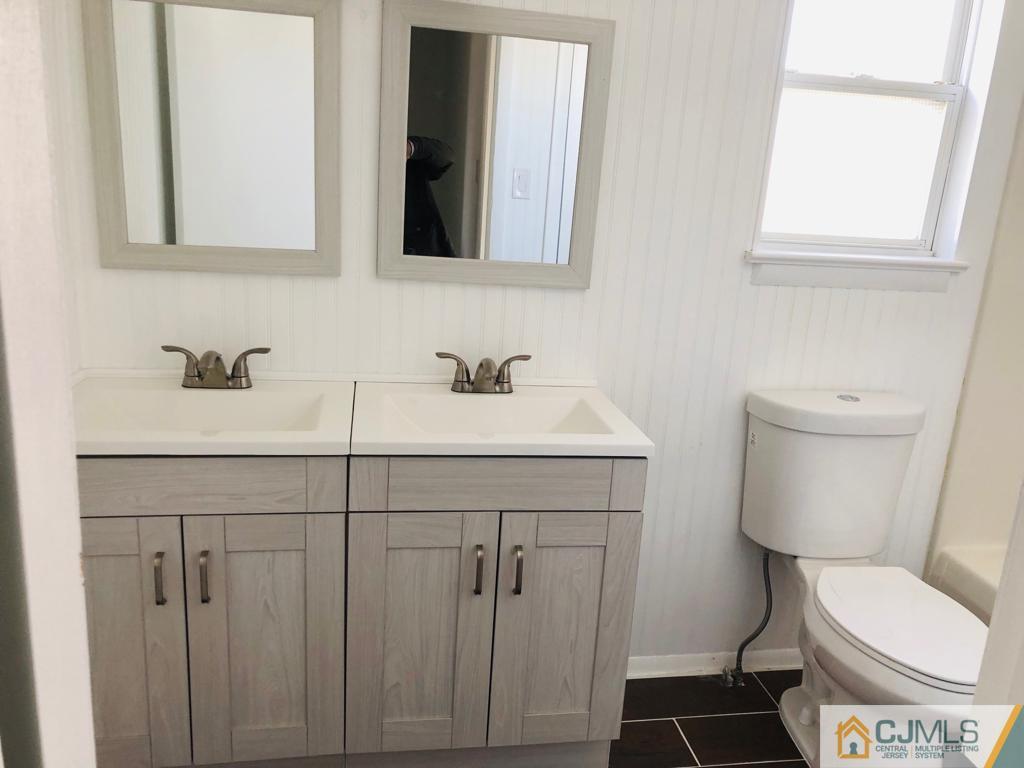 902 Salem Road Burlington, NJ 08016 - Photo 9 of 17 a bathroom with a sink toilet and mirror