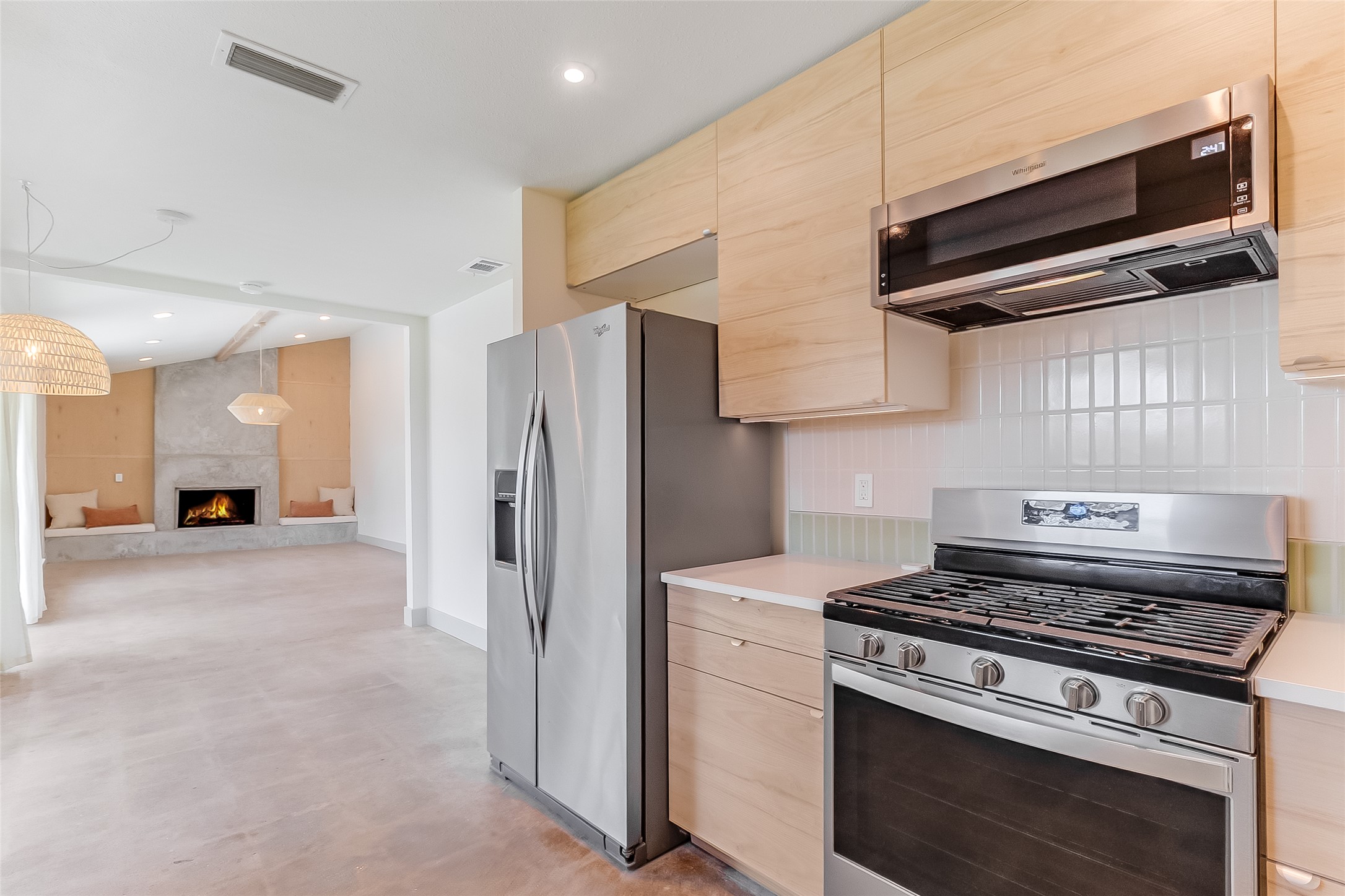 10101 Rutland Village East Austin, TX 78758 - Photo 11 of 26 New Whirlpool gas stove, matching microwave and stainless steel side by side refrigerator