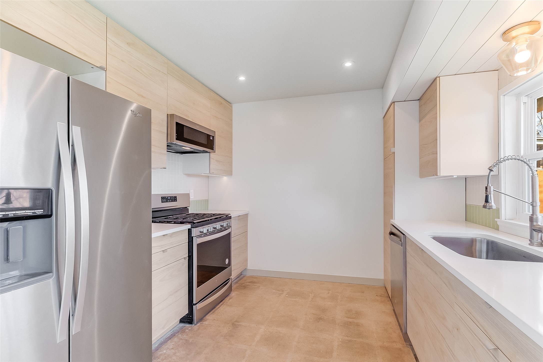 10101 Rutland Village East Austin, TX 78758 - Photo 12 of 26 Kitchen features a floor-to-ceiling pantry with pull-out drawers; new quartz countertops