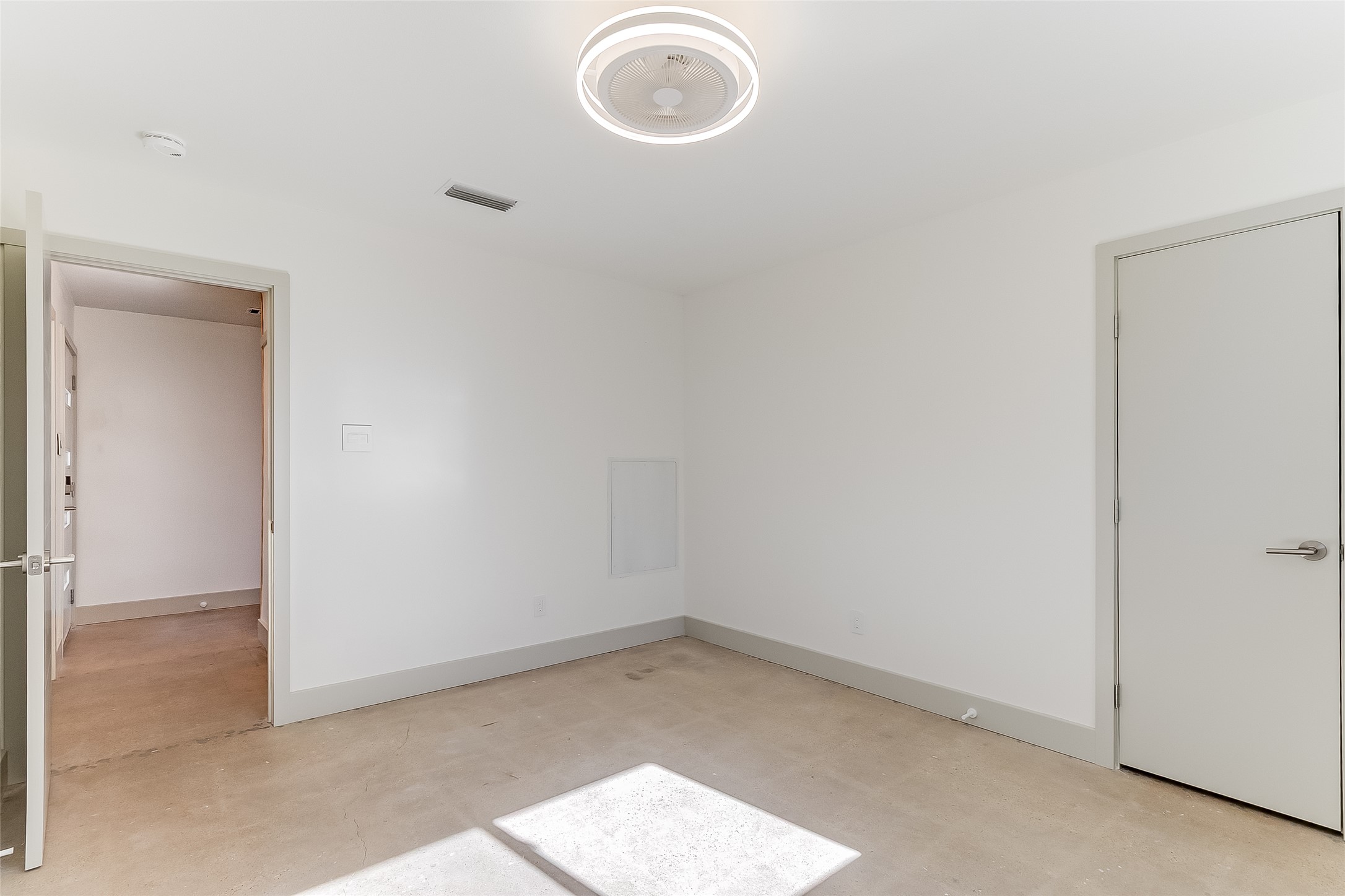 10101 Rutland Village East Austin, TX 78758 - Photo 17 of 26 Secondary bedroom located downstairs with Elfa closet system in the closet.
