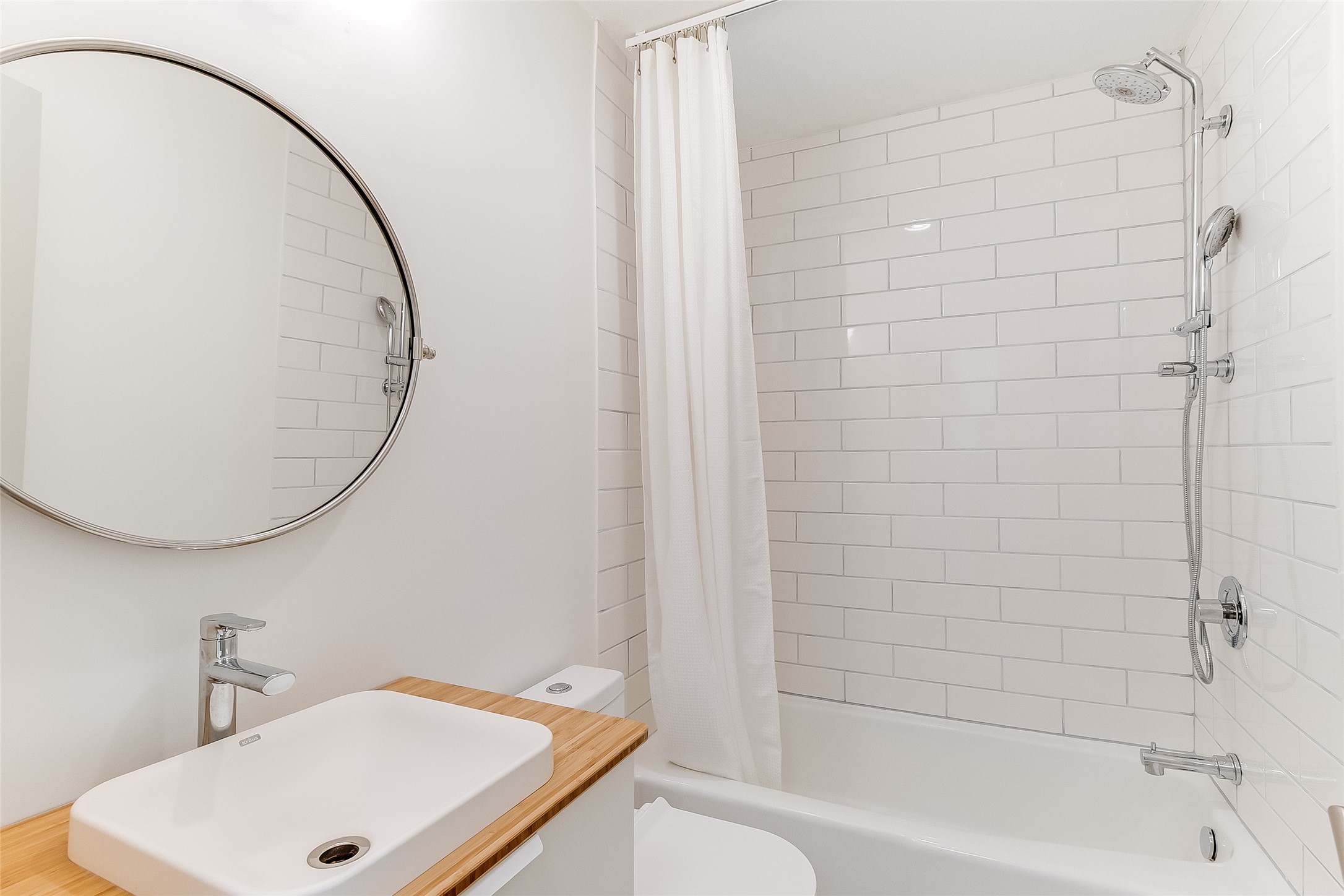 10101 Rutland Village East Austin, TX 78758 - Photo 19 of 26 2nd downstairs bathroom with tub/shower combination, LVP terrazzo tile floor and new toilet