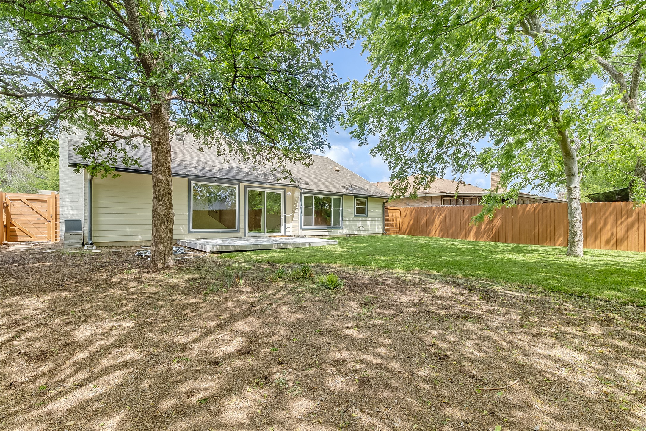 10101 Rutland Village East Austin, TX 78758 - Photo 23 of 26 Back yard oasis, with composite deck for outdoor BBQ's and privacy stained cedar wood fence