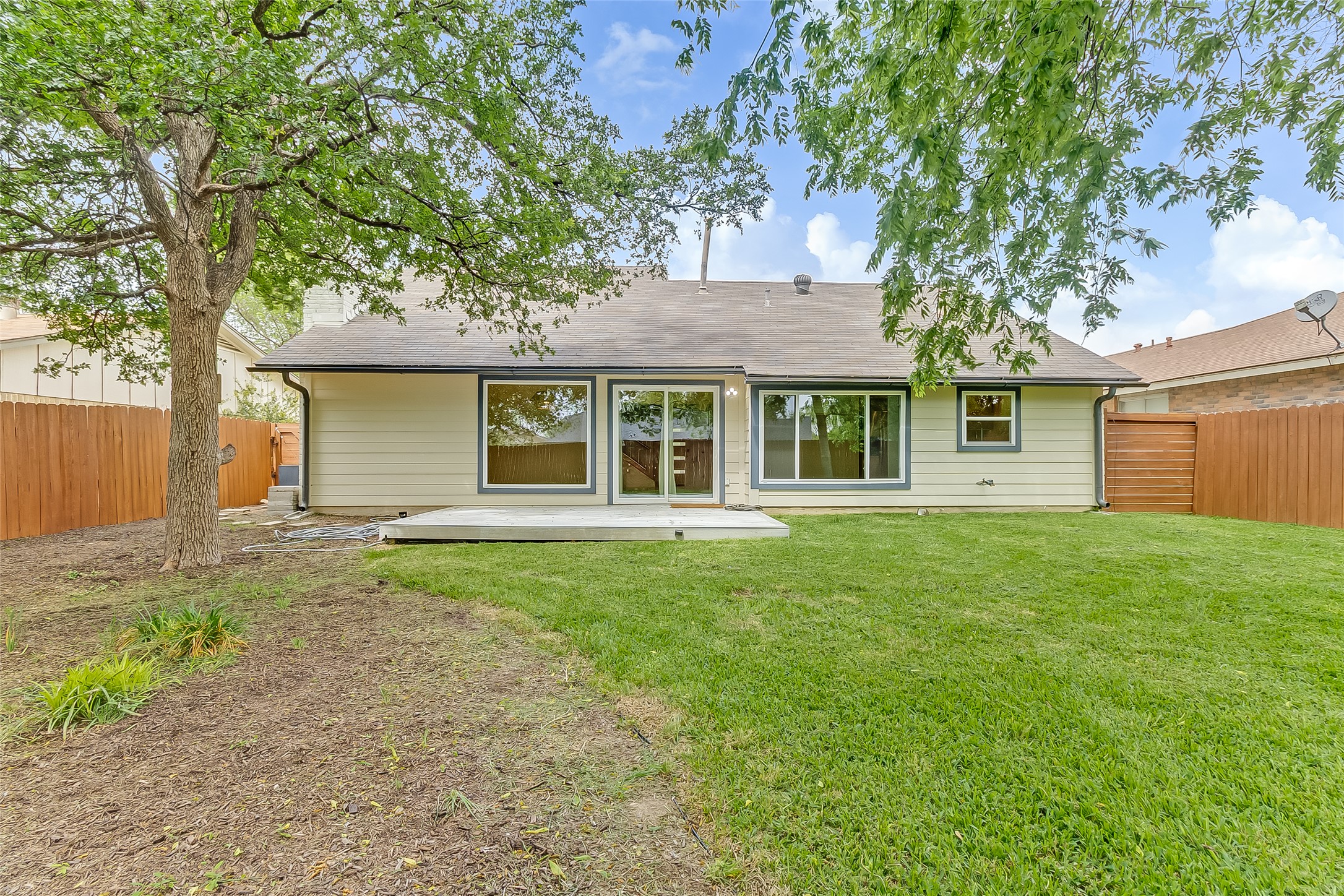 10101 Rutland Village East Austin, TX 78758 - Photo 24 of 26 Beautiful landscaped backyard with fresh sod and area to create your own play area.
