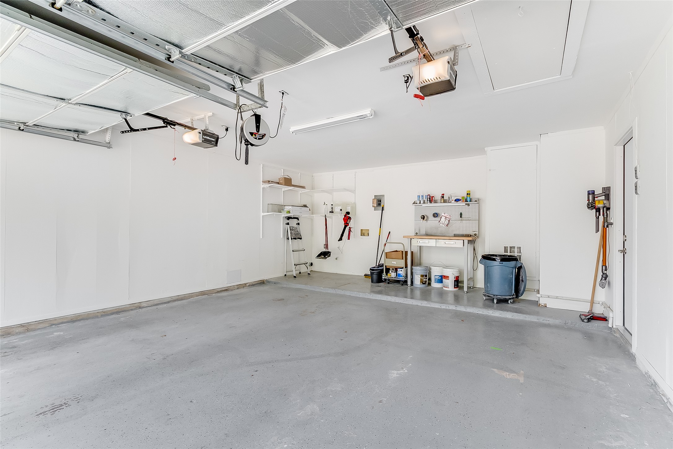 10101 Rutland Village East Austin, TX 78758 - Photo 25 of 26 Be sure to notice the epoxy garage floor, Elfa closet system installed about the washer/dryer hookups