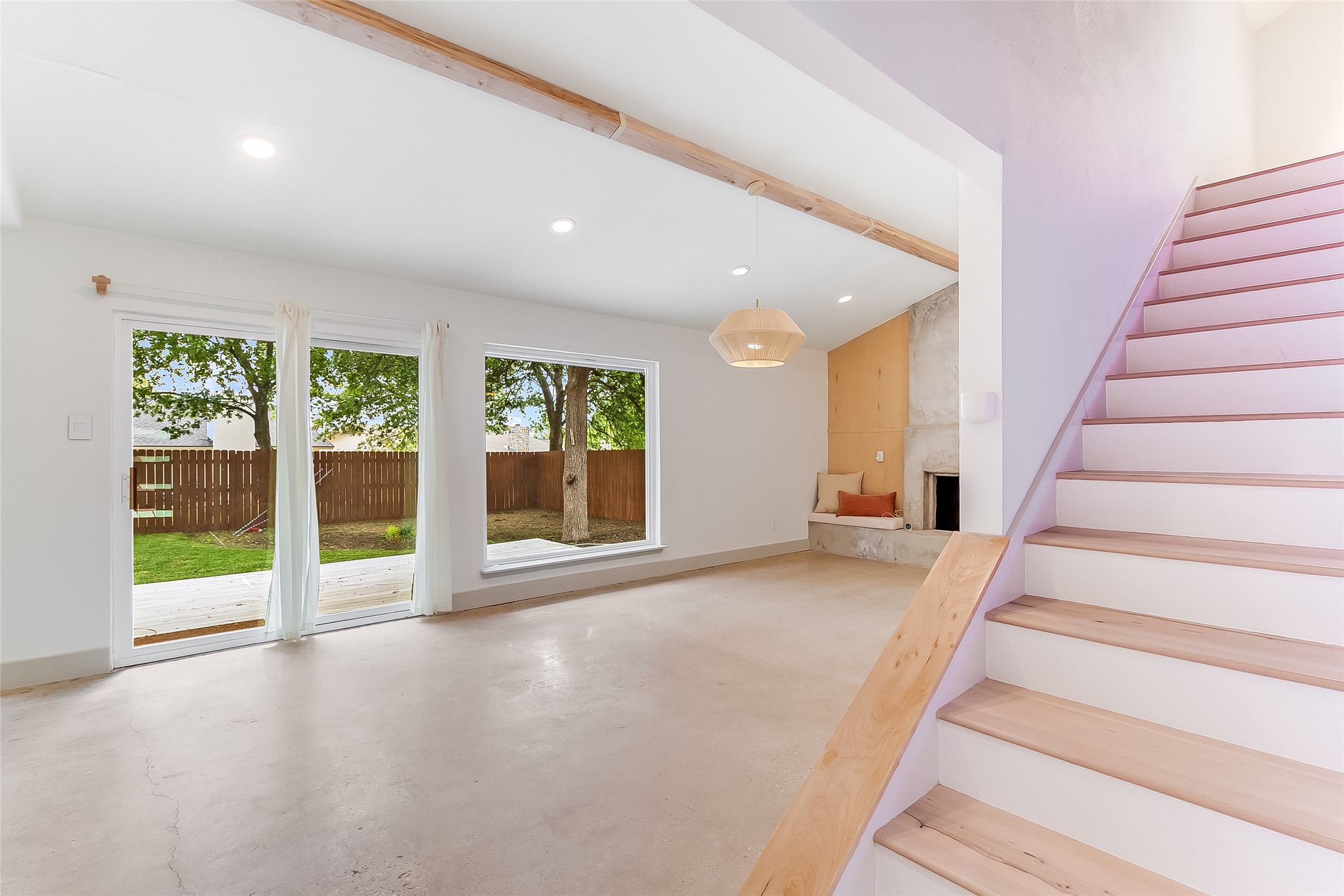 10101 Rutland Village East Austin, TX 78758 - Photo 4 of 26 Wood lighted stairway, off the family room with polished concrete floors, large picture window which allows abundant natural light.